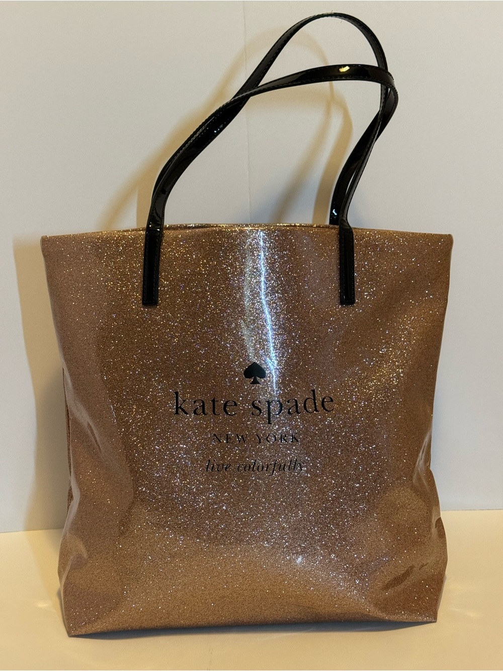 kate spade Glittery Rosegold Tote with Black Handles